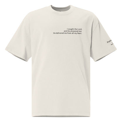 White oversized Christian t-shirt with Psalm 34:4 printed on front and verse reference on left sleeve